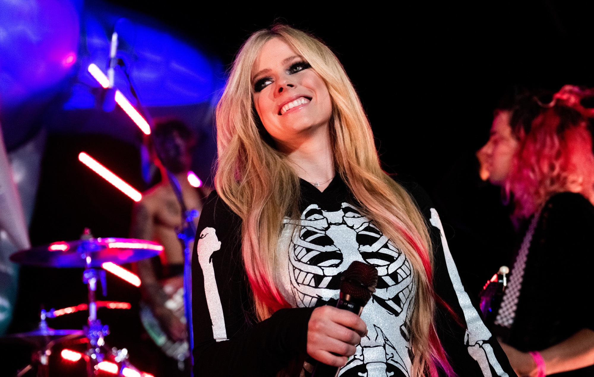 Avril Lavigne performs live in skeleton costume for a Halloween livestreamed show