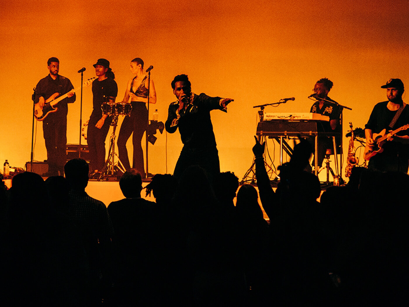 Leon Bridges performing live onstage with his band