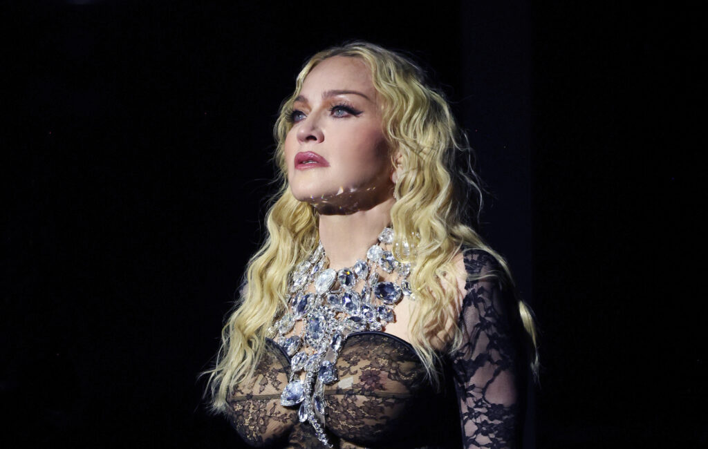 fans-defend-madonna-after-“ageist”-trolls-incorrectly-mock-her-for-using-support-beam-at-show